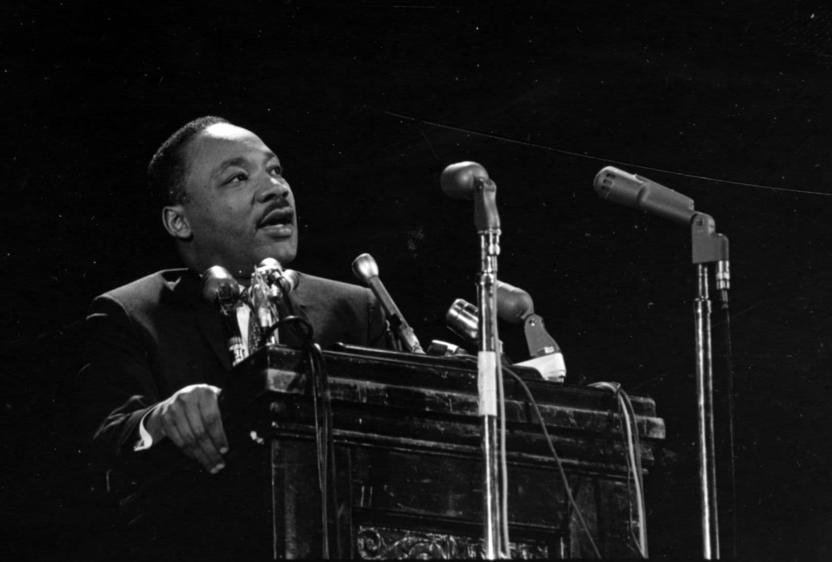 Martin Luther King, Jr. standing behind podium at Stanford University